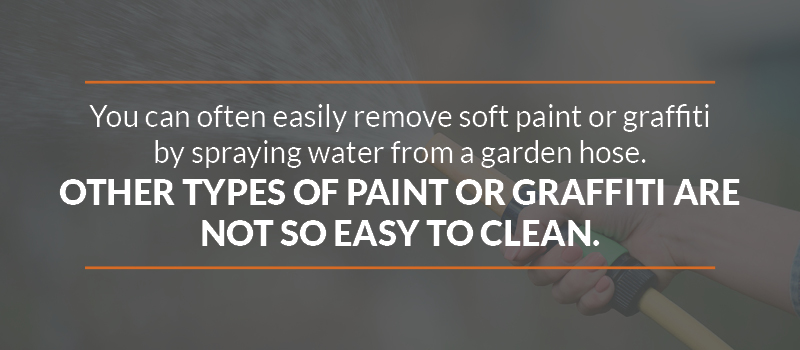 Soft pair or graffiti may sometimes be removed by spraying water from a garden hose